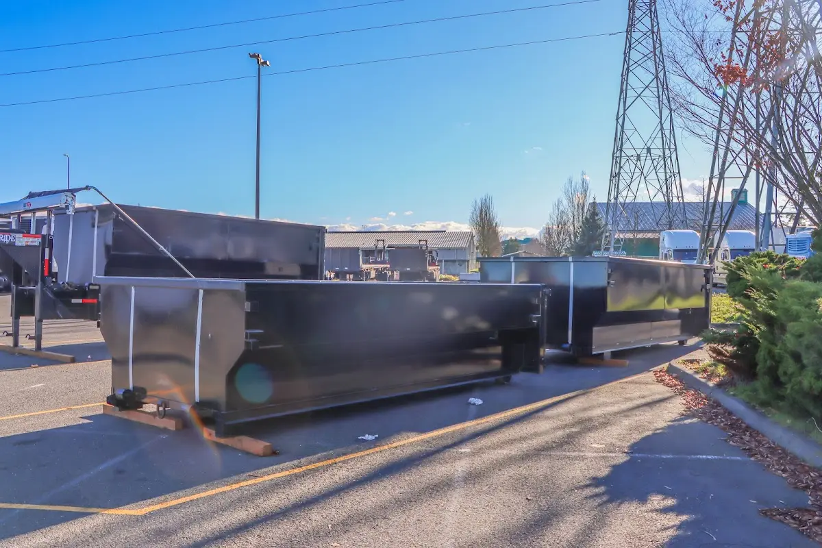 Roll-off dumpster ready for waste disposal at job site for Concrete Dumpster Rental in Mashpee